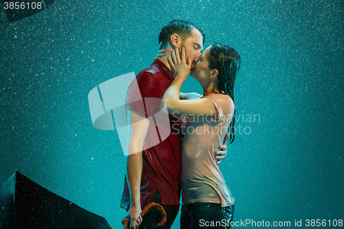 Image of The loving couple in the rain