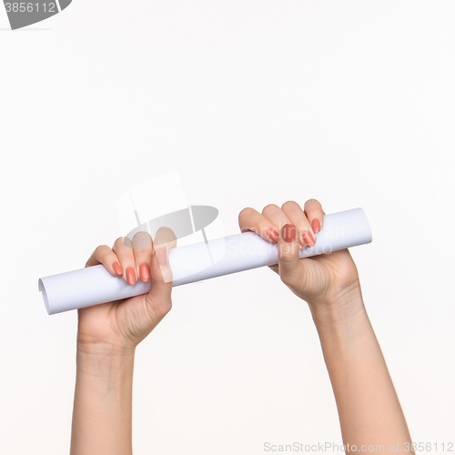 Image of The cylinder female hands on white background