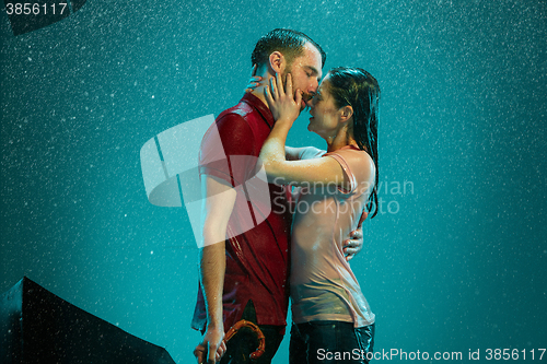 Image of The loving couple in the rain