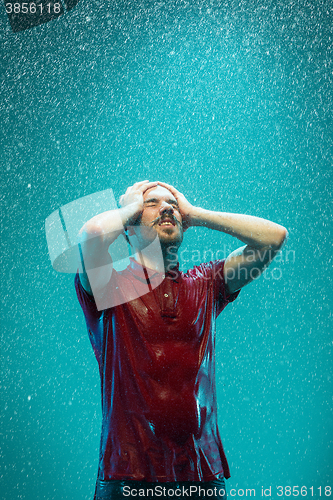 Image of The portrait of young man in the rain