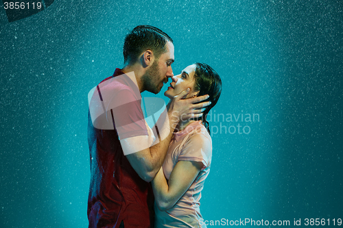 Image of The loving couple in the rain