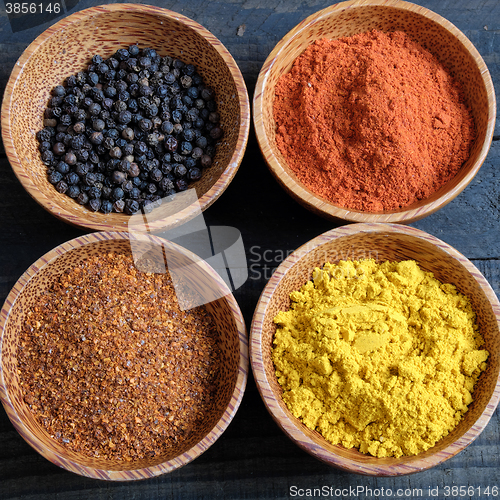 Image of Colorful spice powder, chilli, pepper, turmeric, cashew 