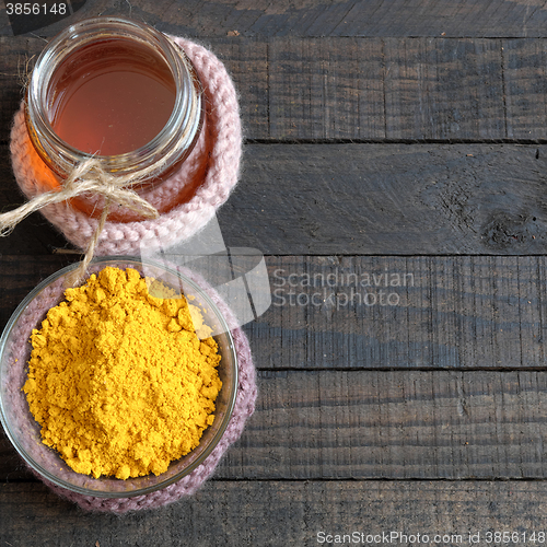 Image of Turmeric powder, honey, healthy food, cosmetic