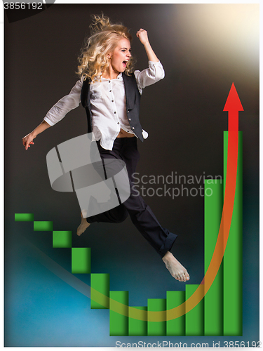 Image of Businesswoman runing up a stairway and growing sales chart