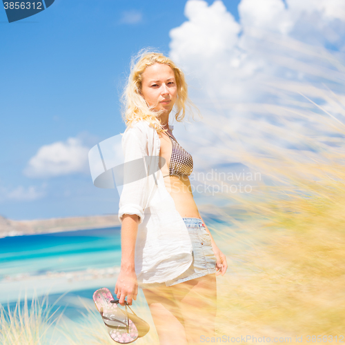 Image of Free Happy Woman Enjoying Sun on Vacations.