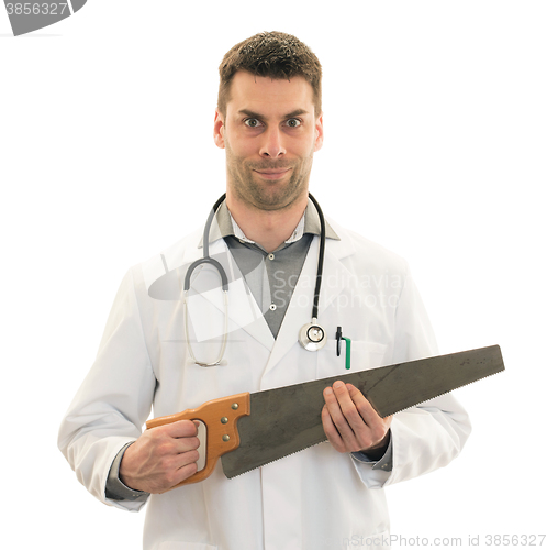 Image of Crazy doctor is holding a big saw in his hands