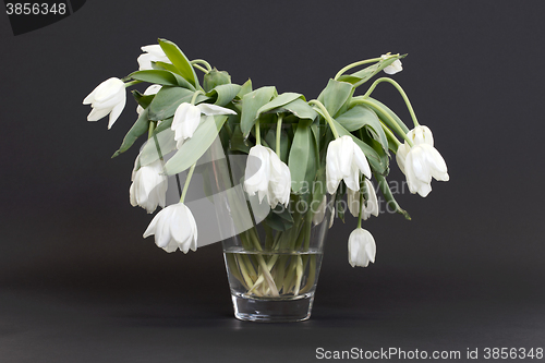 Image of Vase full of droopy and dead flowers