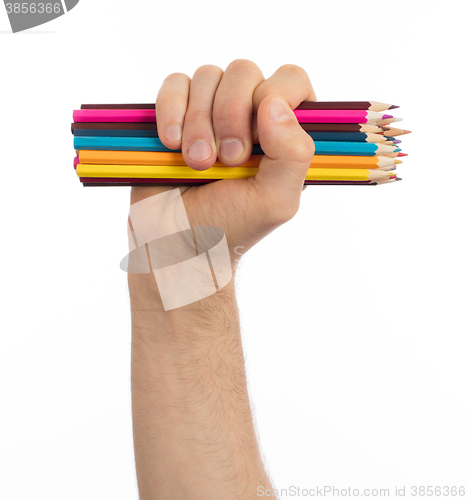 Image of Used pencils in hand isolated