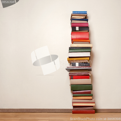 Image of Old books on wooden floor