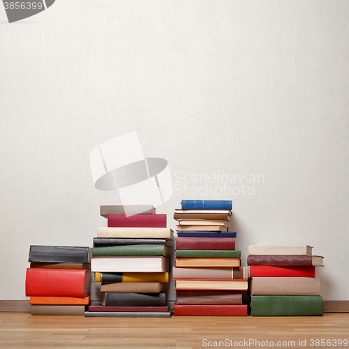 Image of Old books on wooden floor