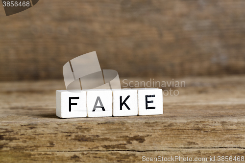 Image of The word fake written in cubes