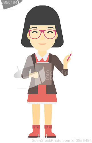Image of Woman standing with pen and file in hands.