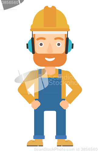 Image of Man wearing hard hat and headphones 