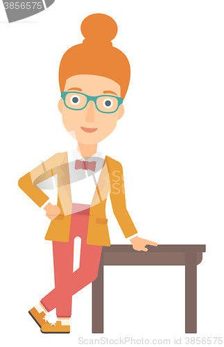 Image of Woman leaning on table.