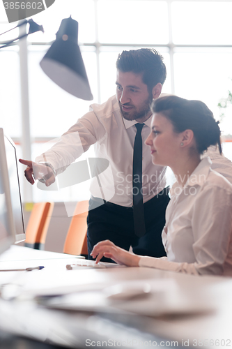 Image of business couple working together on project