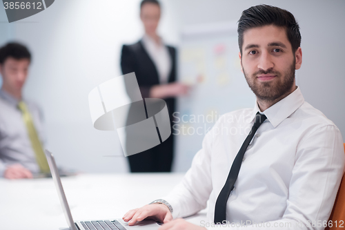 Image of young business man at meeting