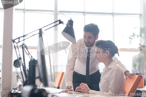 Image of business couple working together on project