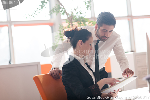 Image of business couple working together on project