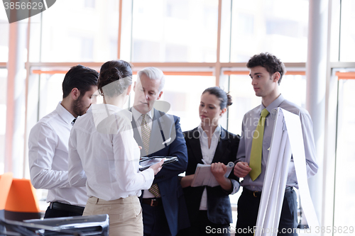 Image of young startup businessman making presentation to senior investio