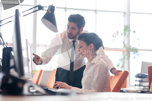 Image of business couple working together on project