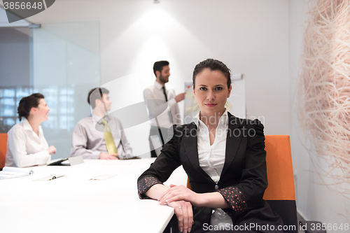 Image of young business woman on meeting  using laptop computer