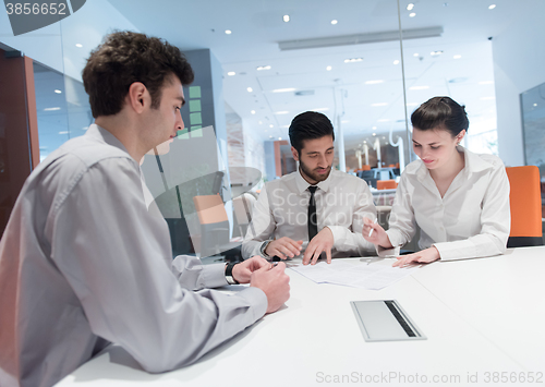 Image of young couple signing contract documents on partners back