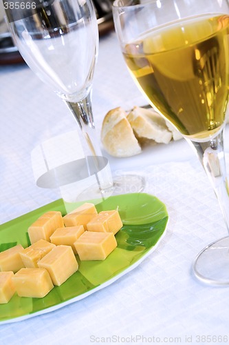 Image of Close up on a plate of cheese with Wine Glasses