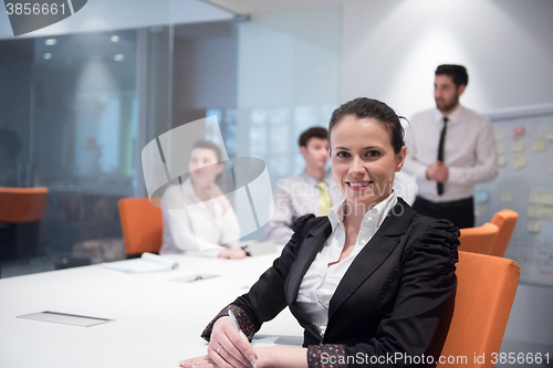 Image of young business woman on meeting  using laptop computer