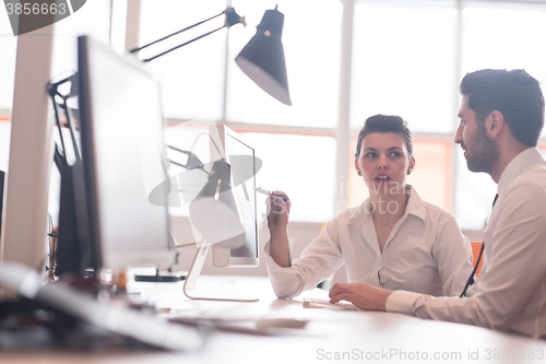 Image of business couple working together on project