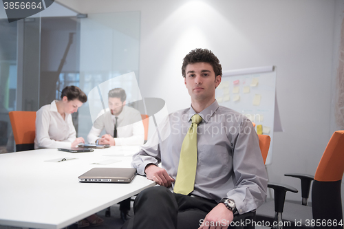 Image of portrait of young business man at modern office