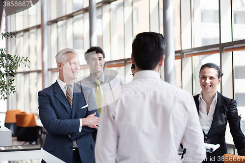 Image of young startup businessman making presentation to senior investio