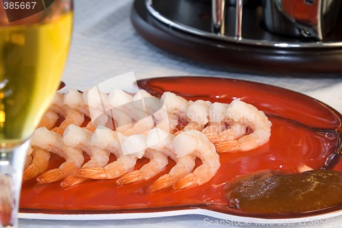 Image of Shrimps on a Plate with a Blurred Wine Glass in the foreground