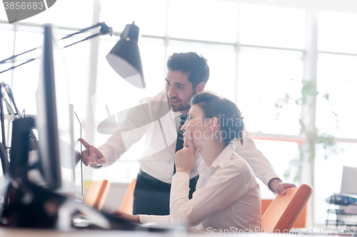 Image of business couple working together on project