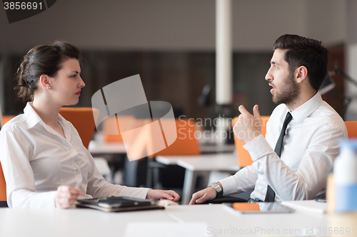 Image of business couple working together on project