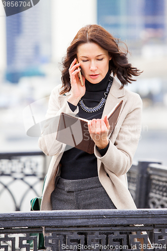 Image of business woman talking on a cell phone