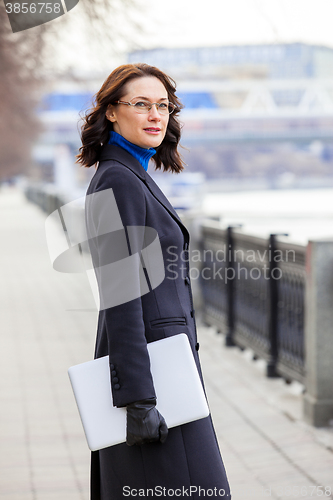 Image of business middle-aged woman