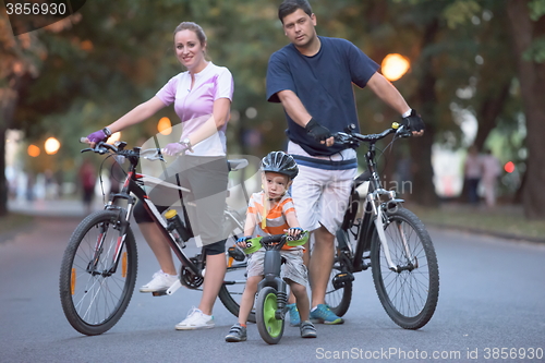 Image of young family with bicycles