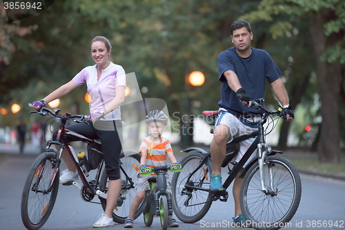 Image of young family with bicycles