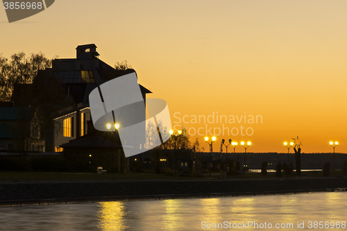 Image of House on lake shore at afterglow