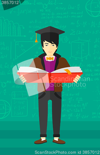 Image of Man in graduation cap holding book.