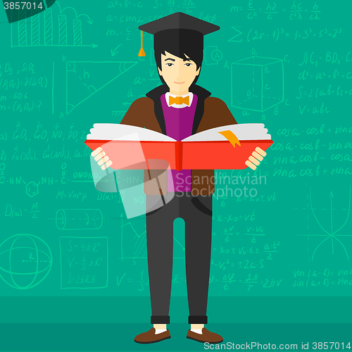 Image of Man in graduation cap holding book.