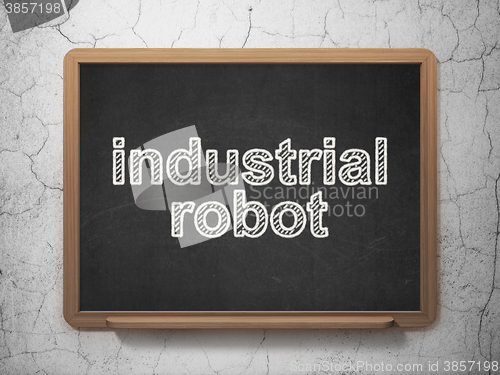 Image of Manufacuring concept: Industrial Robot on chalkboard background