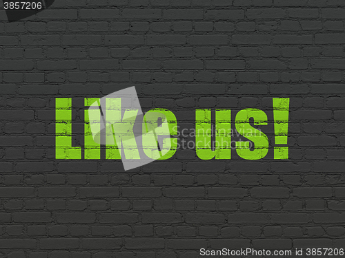 Image of Social network concept: Like us! on wall background