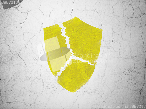 Image of Safety concept: Broken Shield on wall background