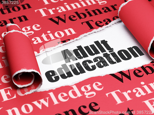 Image of Learning concept: black text Adult Education under the piece of  torn paper