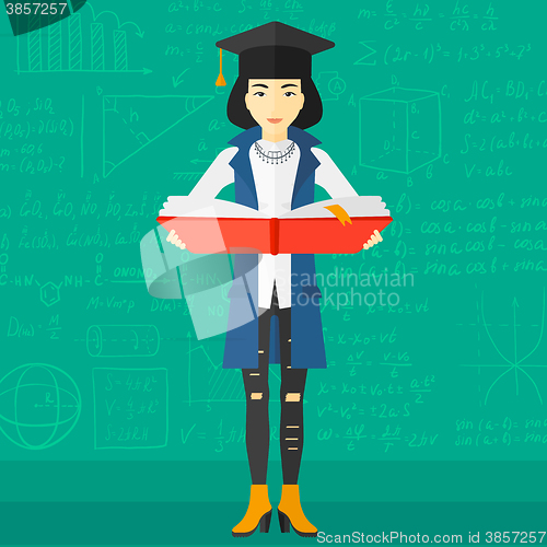 Image of Woman in graduation cap holding book.