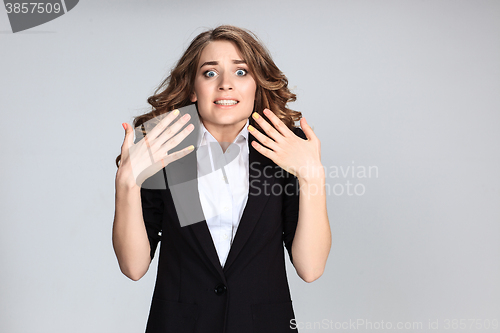 Image of Portrait of young woman with shocked facial expression