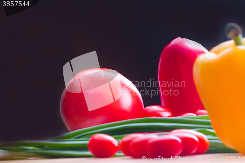 Image of vegetables on a wooden background