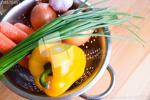 Image of vegetables on a wooden background