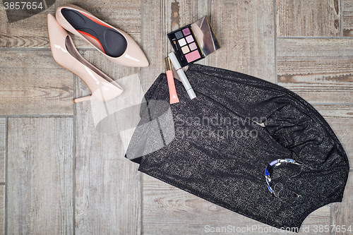 Image of Overhead view of female fashion with accessories.